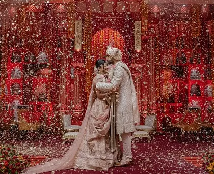 The perfect end to a perfect night. This shot captures the couple sharing a moment amidst the celebration, a testament to the joy and memories created through a thoughtfully curated entertainment experience.