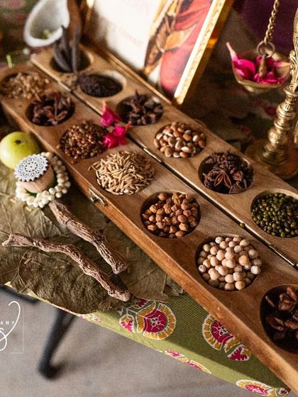 Another shot of the legacy counter, highlighting the rich textures of the silk sarees and the traditional grains.