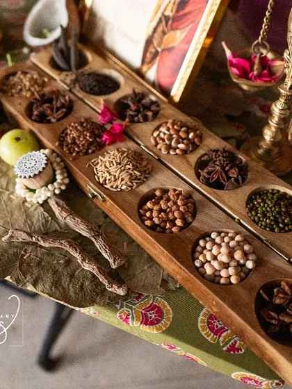 Another shot of the legacy counter, highlighting the rich textures of the silk sarees and the traditional grains.