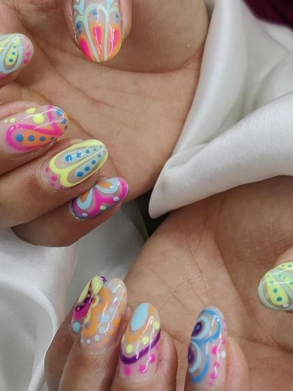 This view shows how the intricate patterns look across all the nails, creating a cohesive and stunning set of wearable art.