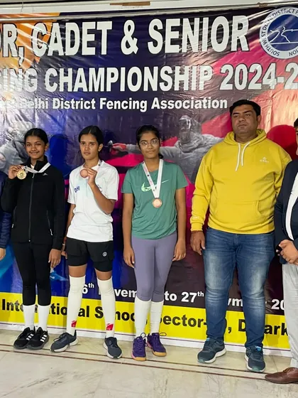 Another group of our talented female fencers with their medals at the Delhi State Championship, standing alongside their proud coach.