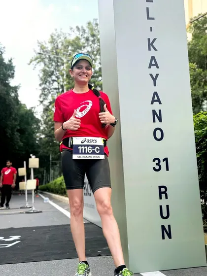 A runner gives a thumbs up next to the 'Gel Kayano 31 Run' sign. We celebrate new gear and the innovations that help us run better.