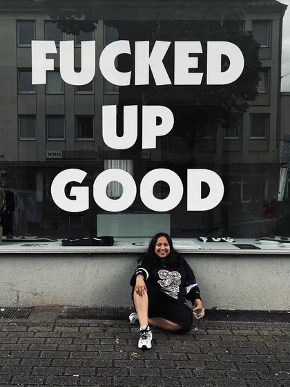 A moment of reflection in Germany. The phrase on the window, "Fucked Up Good," perfectly captured the beautiful chaos of the tour.