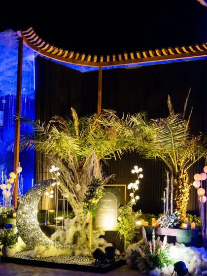 A wider view of the celestial-themed birthday decor, featuring a sparkling crescent moon prop perfect for photos.