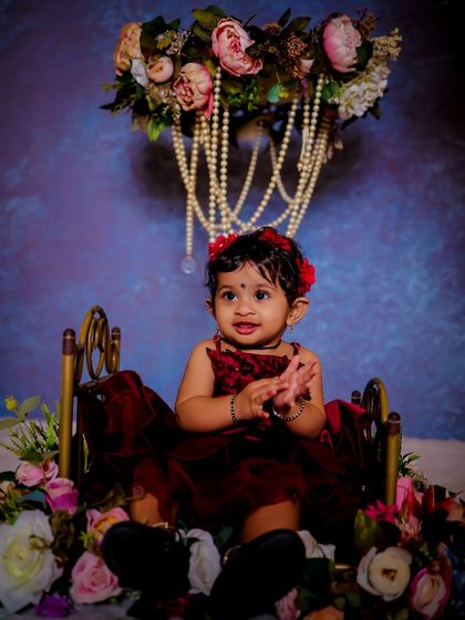 Explore our various floral and elegant setups. These sets feature props like swings, ornate chairs, and pearl decorations, all surrounded by beautiful flowers for a timeless and pretty photoshoot.