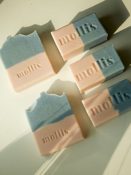 An assortment of 'Sweet Sage' bars, some with textured tops and some with smooth finishes.