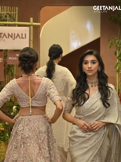 A glimpse from our grand flagship launch in Ahmedabad. Our models, styled in collaboration with designer Ridhi Mehra, showcase the elegant hair and makeup our team created for the event.
