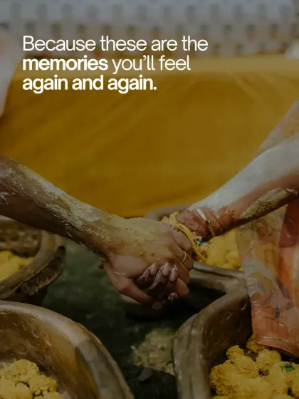 A close up shot of the couple's hands, covered in turmeric paste, clasped together. This image symbolizes their connection and shared experience during the ritual.