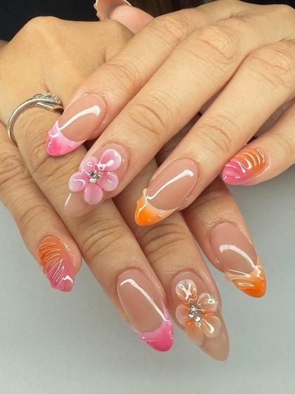 A beautiful combination of ombre tips and 3D flowers. This design teaches how to blend different techniques seamlessly for a cohesive and professional look.