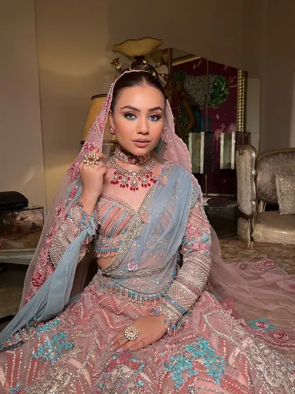 The bride looking like royalty in her stunning outfit and elegant updo.