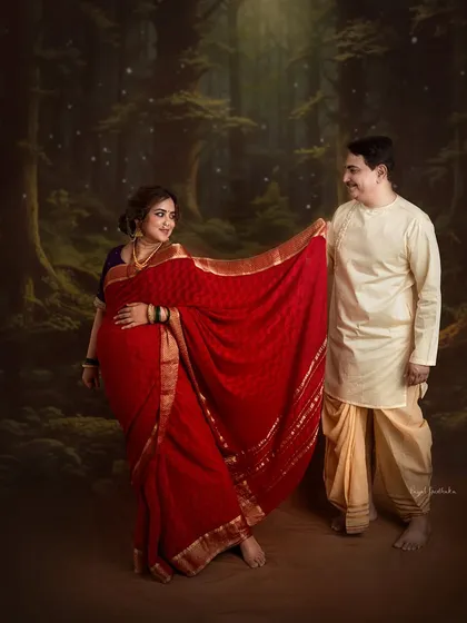 A joyful and dynamic pose that captures the couple's chemistry, set against a magical forest backdrop that enhances the fairytale feel of their love story.