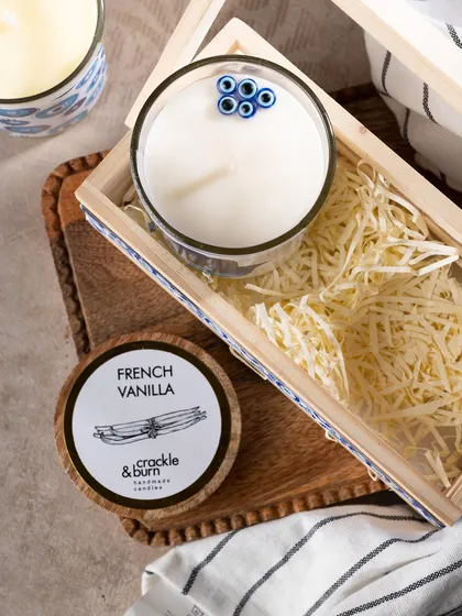 A closer look at the details of my evil eye hamper. The French Vanilla scented candle is topped with tiny evil eye beads.