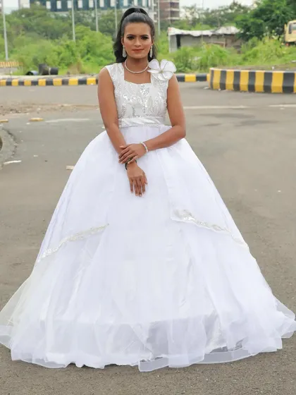 An angelic look in a white gown. The student created a soft, ethereal makeup style for this photoshoot.