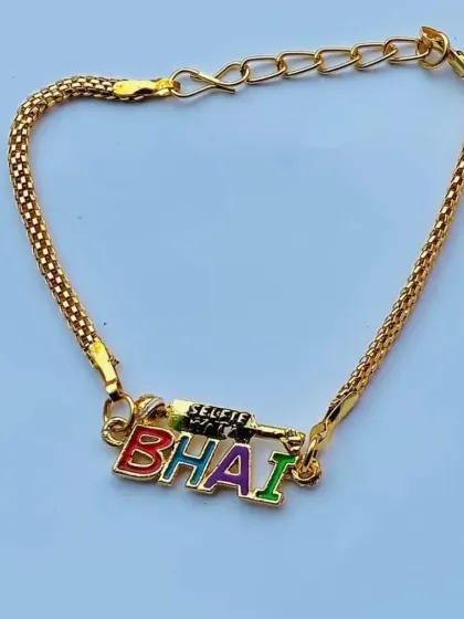 This "BHAI" rakhi features vibrant, multicolored letters and a unique gun-shaped charm for a bit of extra personality.