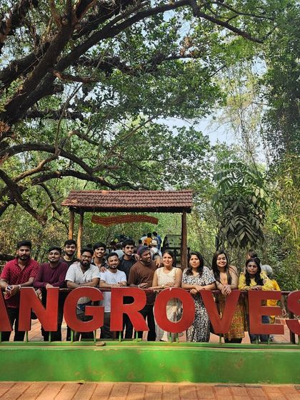 Our group posing with the "Mangroves" sign at the entrance to the Honnavar boardwalk.