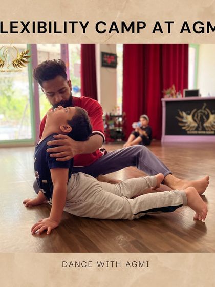 An instructor provides gentle support to a young student's back and neck during a stretch. This ensures the spine is protected while improving mobility in the upper back and shoulders.