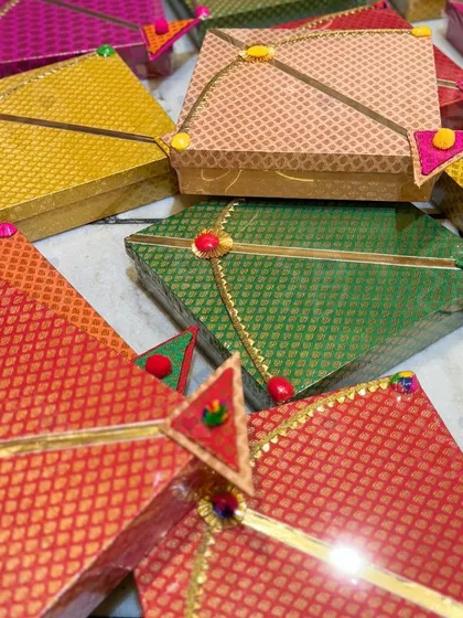 A collection of my 'Patang Mithaai' boxes for Lohri. Available in a variety of rich, brocade fabrics, these kite-shaped boxes are a unique and stylish way to gift sweets.