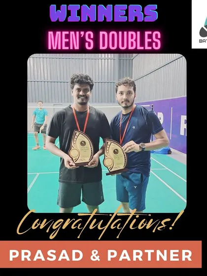 I'm proud to see my students succeed. Here's Prasad and his partner after winning the Men's Doubles category, a testament to their hard work and the effectiveness of our training regimen.