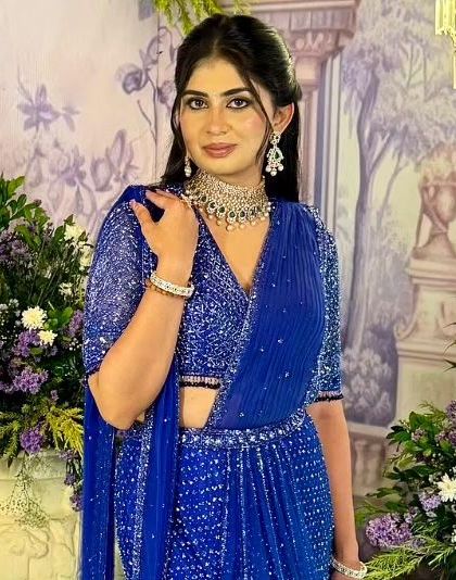 This bride from Hyderabad chose a regal, fully beaded royal blue half saree for her engagement. The color is striking, and the intricate silver beadwork makes it a true statement piece for such a momentous occasion.