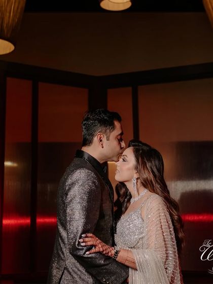 A tender forehead kiss, a quiet moment of connection amidst the grand celebration of their Sangeet night.