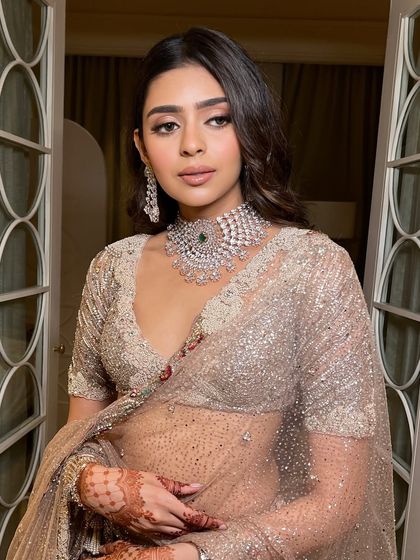 A classic portrait that showcases the stunning diamond choker and the flawless makeup. The look is polished and sophisticated, perfect for a bride who wants to feel glamorous and modern.