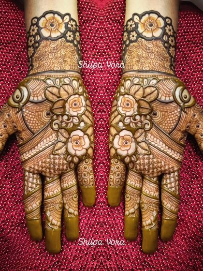 A full floral design with shaded roses, creating a beautiful 3D effect on the hands.