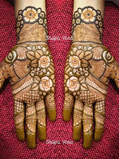 A full floral design with shaded roses, creating a beautiful 3D effect on the hands.
