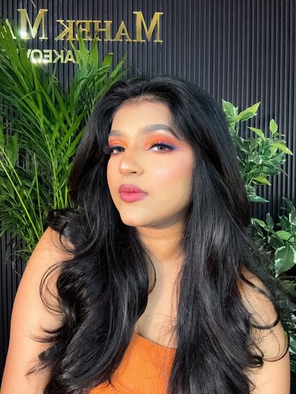 A confident pose showcasing the bold and creative eye makeup. This look is perfect for fashion shoots or a themed party.