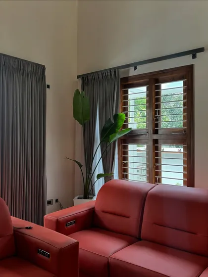 A Bird of Paradise plant adds a touch of the exotic to this living room. Placed by the window, it gets ample light while its large leaves create a beautiful silhouette against the wooden shutters.