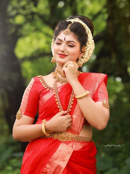 A series dedicated to capturing a divine, traditional look in a striking red saree. These images, shot both in-studio and outdoors, focus on graceful poses and the vibrant color of the attire.
