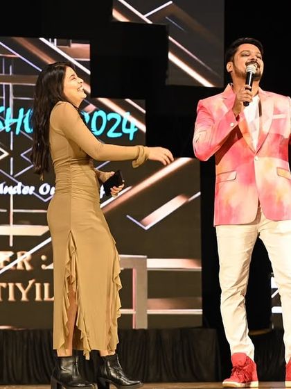 Sharing a dance step and a smile on stage. Hosting is not just about talking; it's about creating a joyful atmosphere where everyone, including the special guests, can let loose and have fun.