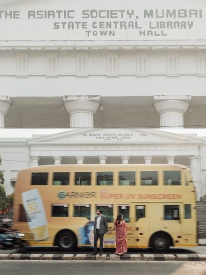 A perfectly timed shot of a yellow double-decker bus passing by as the couple stands before the Asiatic Society. It’s these serendipitous moments that make a shoot unique.