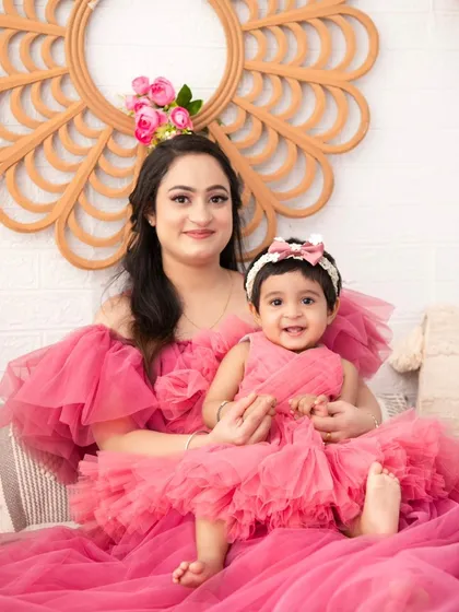 A mother and daughter in matching pink tulle dresses. This portrait is the definition of a fairytale moment, filled with charm and sweetness.