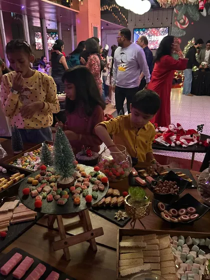 Kids enjoying the candy grazing table. This is pure joy. These tables are an amazing centerpiece and a guaranteed way to make any kid's party a massive hit.