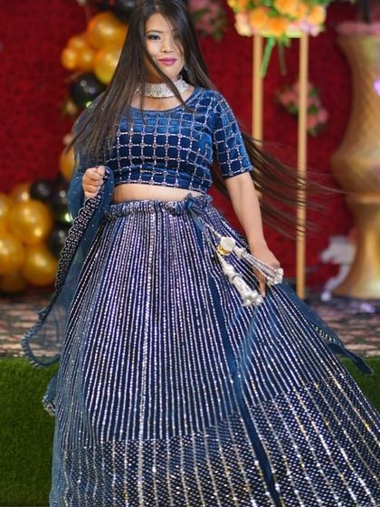 Twirl-ready and full of sparkle. This client is wearing a navy blue velvet lehenga with silver sequin stripes, a perfect rental for a sangeet or reception.