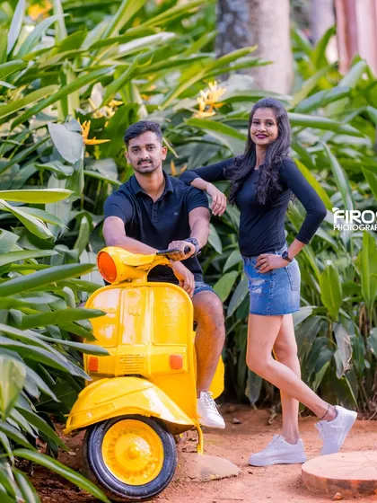 A cool and casual pose with a bright yellow scooter, adding a pop of color and a touch of Italian chic to your photos.