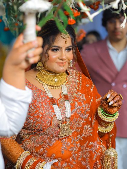 A candid shot of the bride during her entrance, full of life and movement.