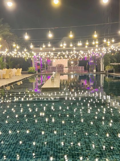 A stunning poolside celebration at the JW Marriott in Bangalore. We used extensive string lighting to illuminate the entire area, with its reflection creating a beautiful effect on the water.
