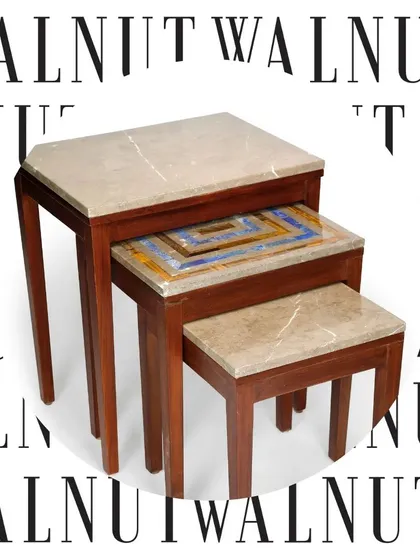 This nest of tables features a unique touch, with the middle table showcasing a colorful geometric stone inlay. It's a perfect example of how I add unexpected artistic details to functional pieces.