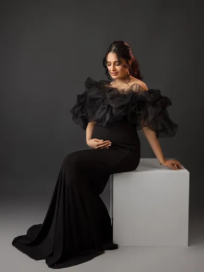 A regal seated portrait, exuding grace and elegance.