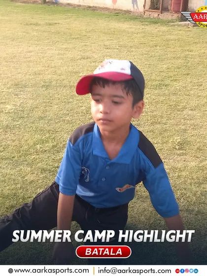 A young player takes a break during a strenuous summer camp session. We teach the importance of both hard work and rest.