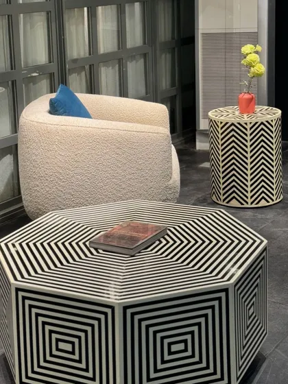 A bold, graphic statement from our collection. This hexagonal coffee table and matching side table feature a striking black and white geometric bone inlay pattern.