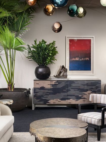 A custom-designed sideboard from our Koko collection, featured in the VIP Lounge. Paired with vibrant art and sculptural lighting, this vignette showcases our ability to create compelling focal points within a larger space.