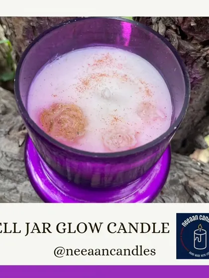 Warmth in a jar. This Bell Jar Glow Candle in a beautiful purple glass holder is perfect for creating a cozy ambiance.