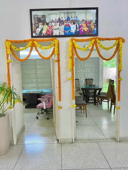 A classic way to decorate office interiors is with floral torans. Here, I have framed two office doorways with yellow and orange marigold garlands, a traditional welcome that brings positive energy into the workspace.