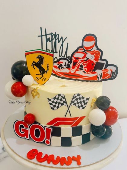 Ferrari dreams and frosting swirls. This go-kart racing cake is a true winner on and off the track.