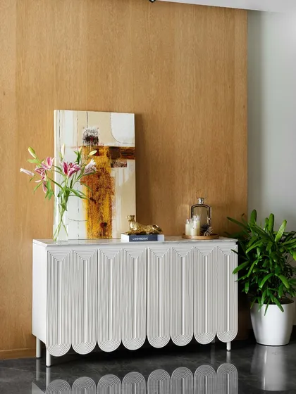 It’s the little details that make a big difference. This beautifully styled white console table with a scalloped design adds charm, elegance, and a touch of personality to the space.