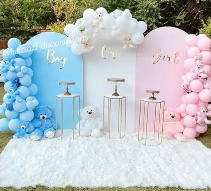 I love creating exciting gender reveal setups like this one. The distinct pink and blue backdrops, adorable teddy bears, and a plush white carpet make the big reveal a picture-perfect moment for the whole family.