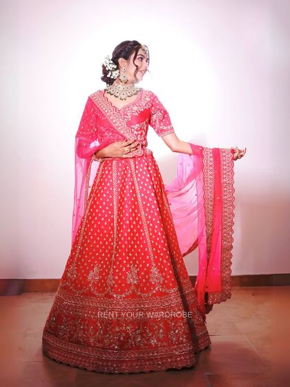 A full shot of the vibrant pink lehenga, showcasing its rich color and detailed embroidery. A fantastic choice for a festive bridal portfolio.