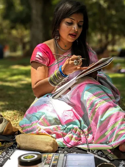 This is me in my happy place, painting outdoors. Creating art isn't just a job; it's how I connect with the world and myself. Every piece I make is filled with the peace and joy I feel in moments like this.